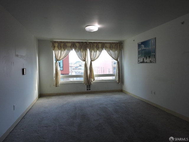 unfurnished room with carpet flooring