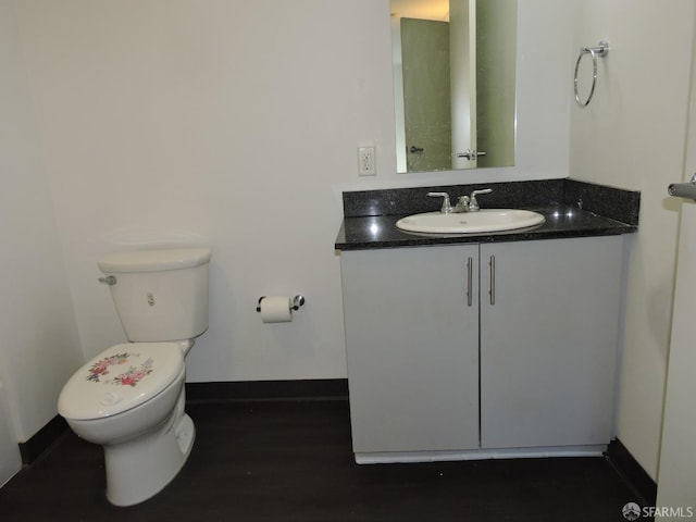 bathroom with toilet and vanity