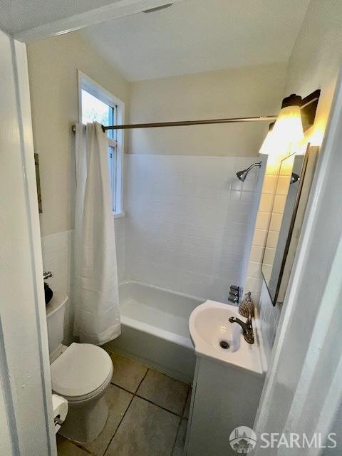 bathroom with tile patterned floors, toilet, and vanity