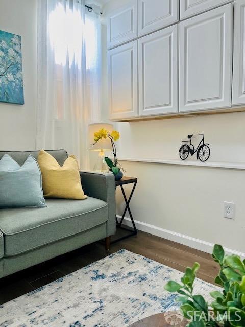 living area with dark wood-type flooring