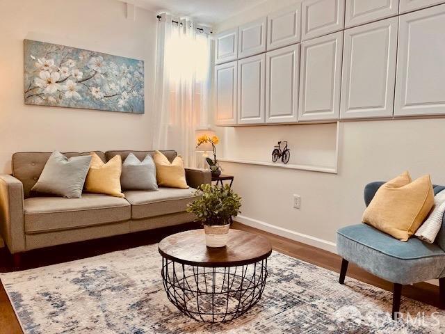 living area featuring dark wood-type flooring