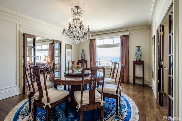 dining room with dark wood-style flooring, plenty of natural light, and crown molding