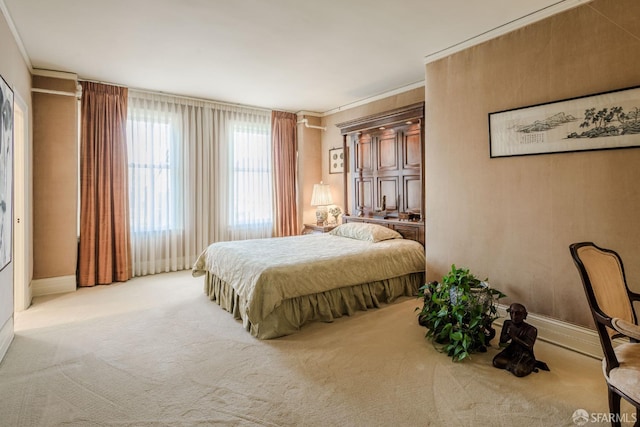 carpeted bedroom with baseboards