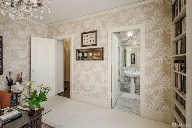 hall featuring wallpapered walls and baseboards