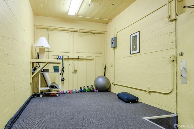 exercise area with wood ceiling and visible vents