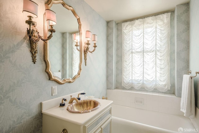 full bathroom with a garden tub and vanity