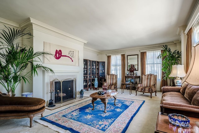 carpeted living room featuring ornamental molding and a high end fireplace