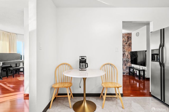 dining space featuring a fireplace