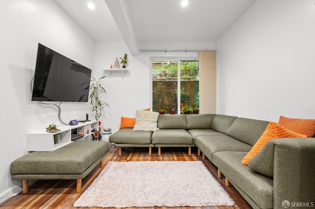 living area featuring wood finished floors, baseboards, and recessed lighting
