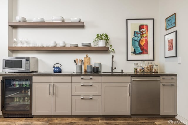 bar with wine cooler, stainless steel dishwasher, white microwave, a sink, and wet bar