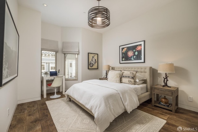 bedroom with recessed lighting, baseboards, and wood finished floors