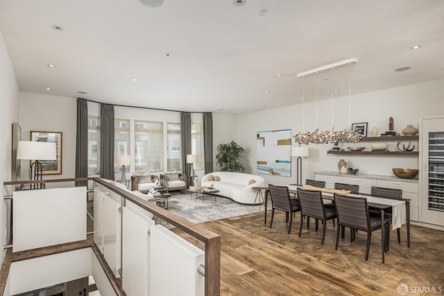 kitchen with open shelves, wood finished floors, white cabinetry, and recessed lighting