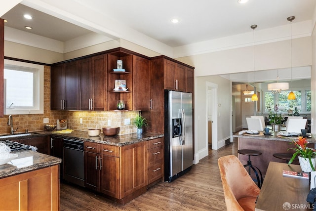 kitchen featuring black dishwasher, a sink, open shelves, stainless steel refrigerator with ice dispenser, and dark stone counters