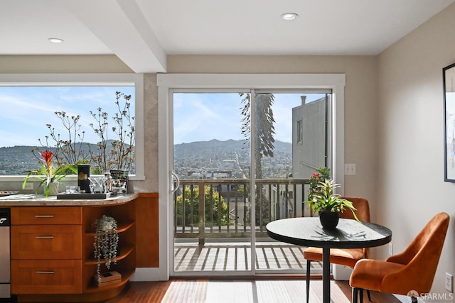 doorway to outside featuring recessed lighting, a mountain view, and wood finished floors