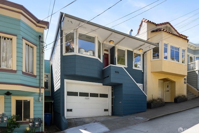 view of front facade featuring stucco siding and a garage