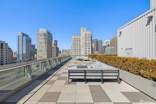 view of patio with a city view and an outdoor hangout area