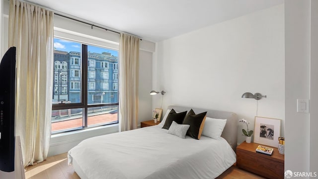 bedroom featuring light wood-type flooring