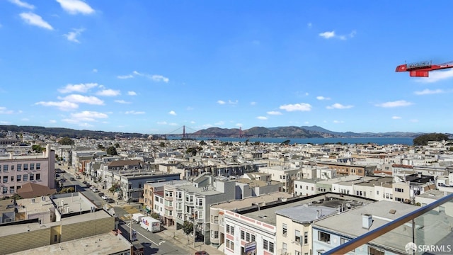 property's view of city with a mountain view