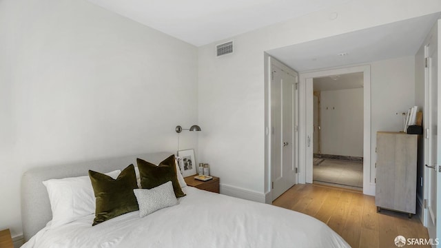 bedroom featuring light wood-type flooring