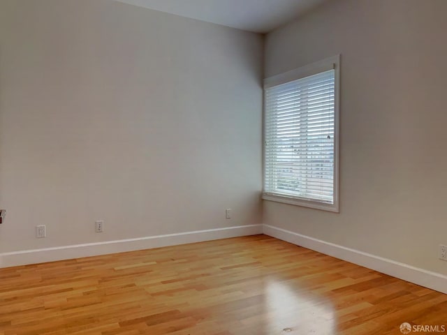 unfurnished room featuring light hardwood / wood-style floors