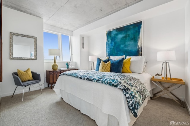 carpeted bedroom featuring baseboards