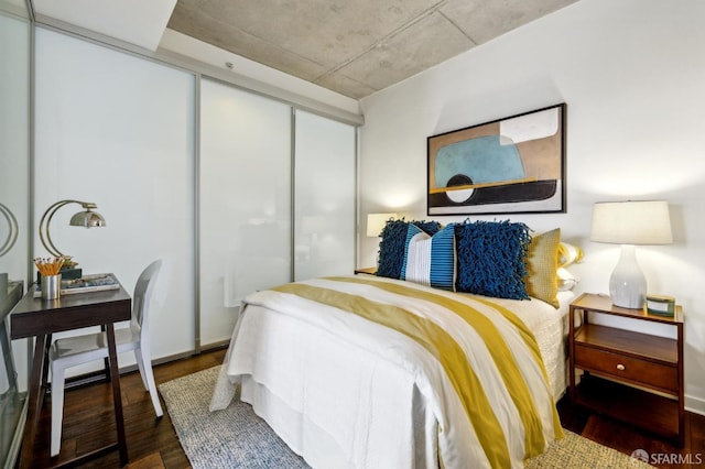 bedroom with a closet and wood finished floors