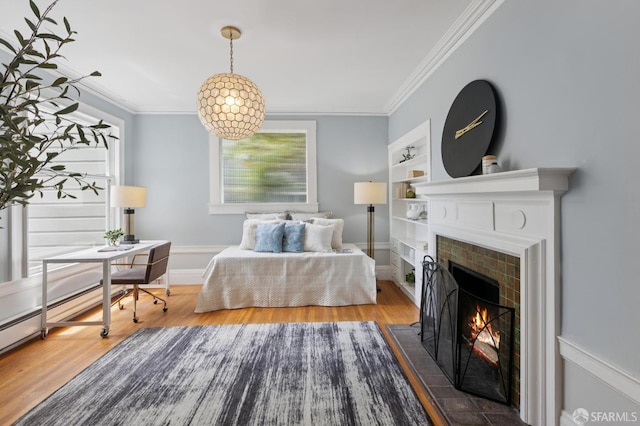 1250 Vallejo St Unit 8, San Francisco, CA 94109 - bedroom with wood finished floors, a fireplace, crown molding, and multiple windows