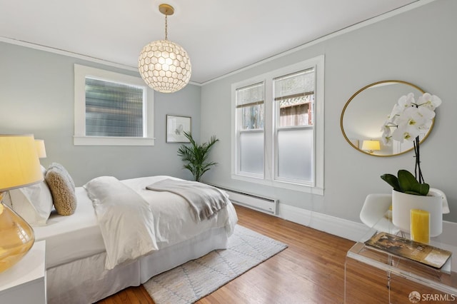 1250 Vallejo St Unit 8, San Francisco, CA 94109 - bedroom with crown molding, a baseboard radiator, and wood finished floors
