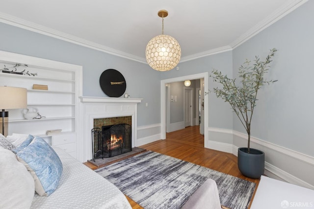 1250 Vallejo St Unit 8, San Francisco, CA 94109 - living room with wood finished floors, a fireplace, ornamental molding, and built in shelves