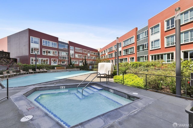 view of pool with fence