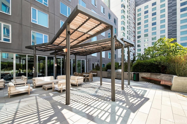 view of patio / terrace with an outdoor living space and a pergola