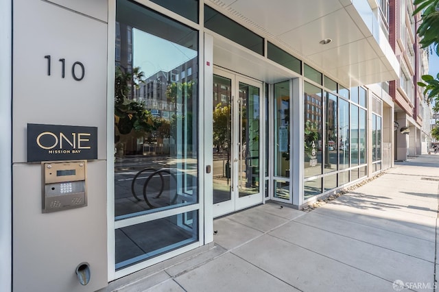 view of exterior entry featuring french doors