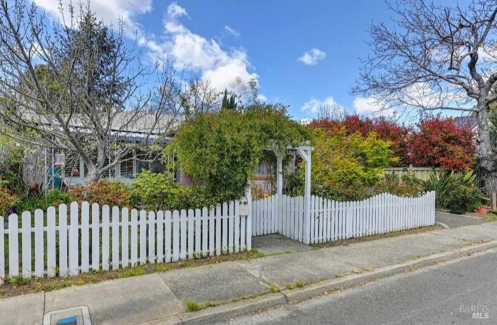 view of gate featuring fence