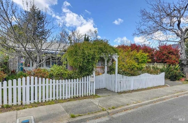 view of gate featuring fence