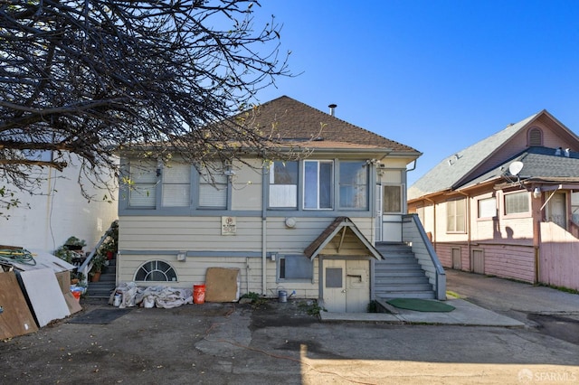 rear view of house with stairway