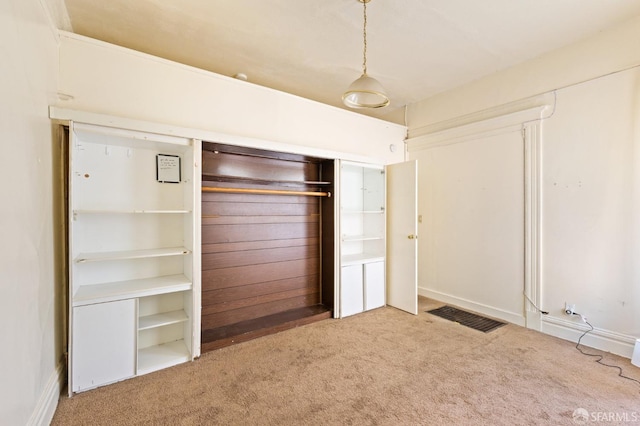 unfurnished bedroom with carpet flooring and visible vents