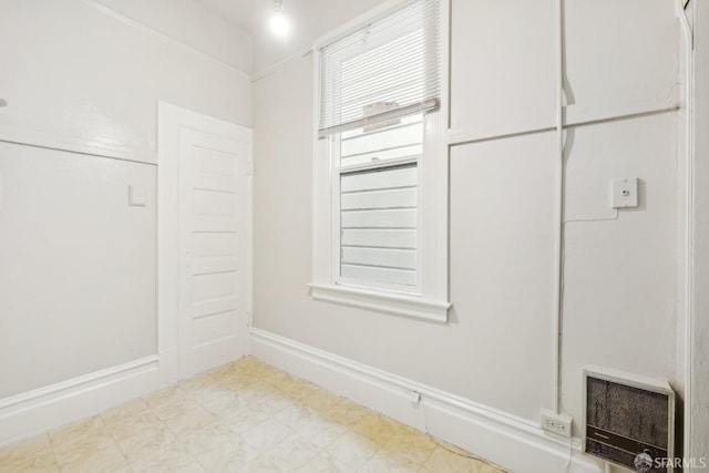 spare room with heating unit