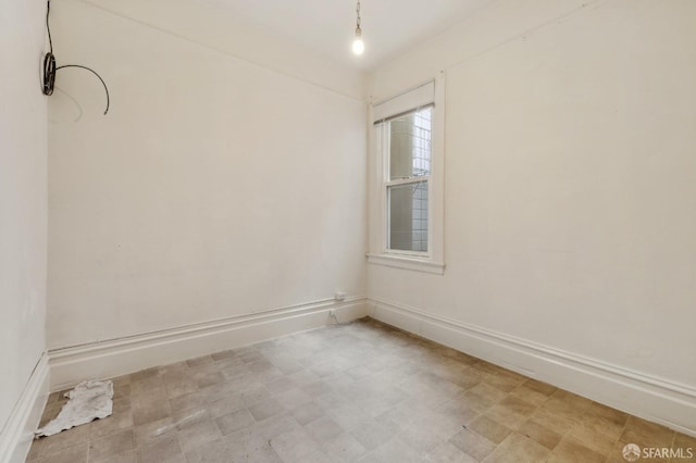 empty room with baseboards