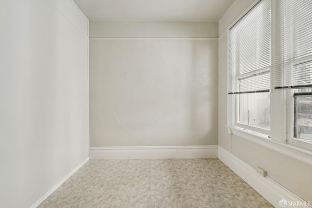 unfurnished room with tile patterned floors