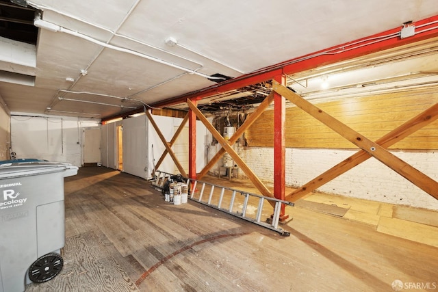 unfinished basement featuring wood finished floors