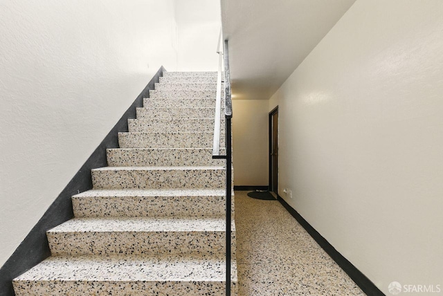 278 7th Ave, San Francisco, CA 94118 - staircase featuring baseboards and speckle patterned floor