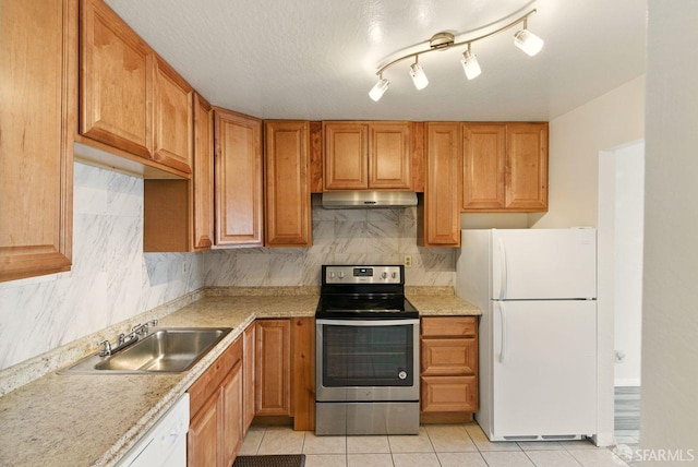 278 7th Ave, San Francisco, CA 94118 - kitchen with white appliances, under cabinet range hood, light countertops, decorative backsplash, and light tile patterned floors