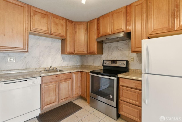 278 7th Ave, San Francisco, CA 94118 - kitchen featuring white appliances, under cabinet range hood, light countertops, backsplash, and light tile patterned flooring