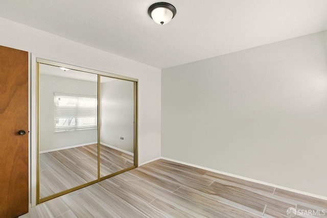 278 7th Ave, San Francisco, CA 94118 - unfurnished bedroom featuring a closet and wood tiled floors