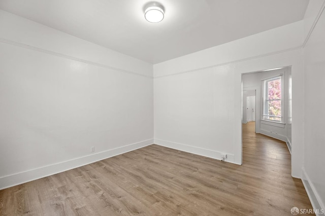 empty room with hardwood / wood-style floors