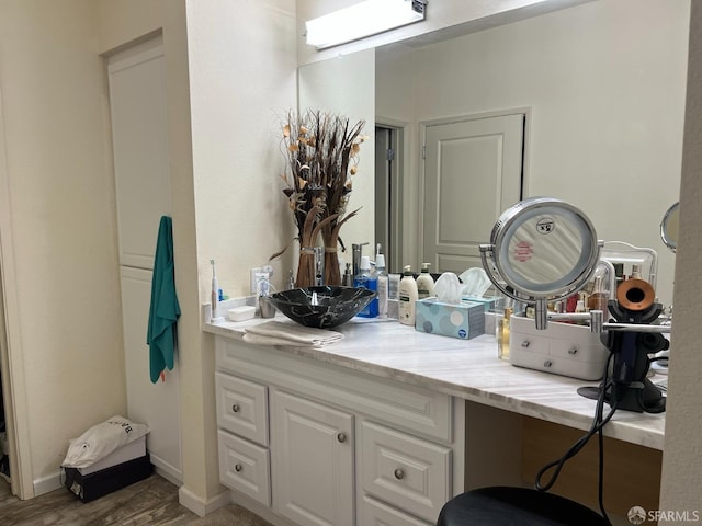 bathroom featuring hardwood / wood-style floors and vanity