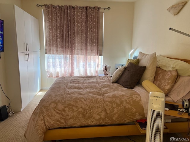 bedroom with light colored carpet