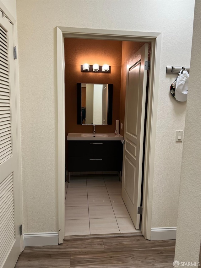 bathroom featuring vanity and hardwood / wood-style flooring