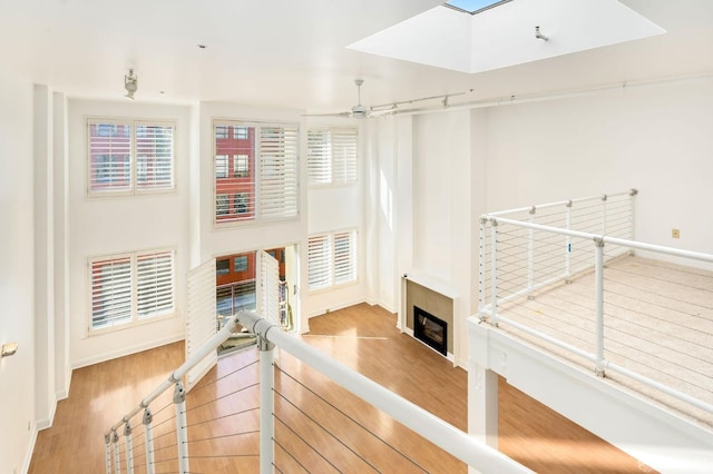 living room with hardwood / wood-style flooring and ceiling fan