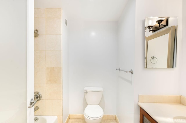 full bathroom featuring tile patterned flooring, vanity, toilet, and tiled shower / bath